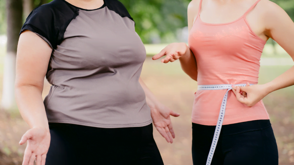 Fit women talking with overweight women